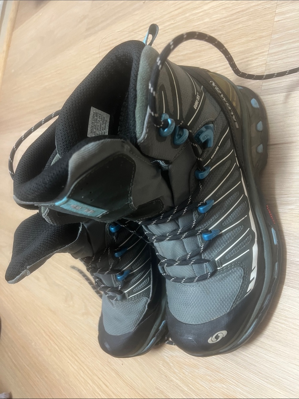 Gray and Black Salomon Women's Hiking Boots with Blue Accents